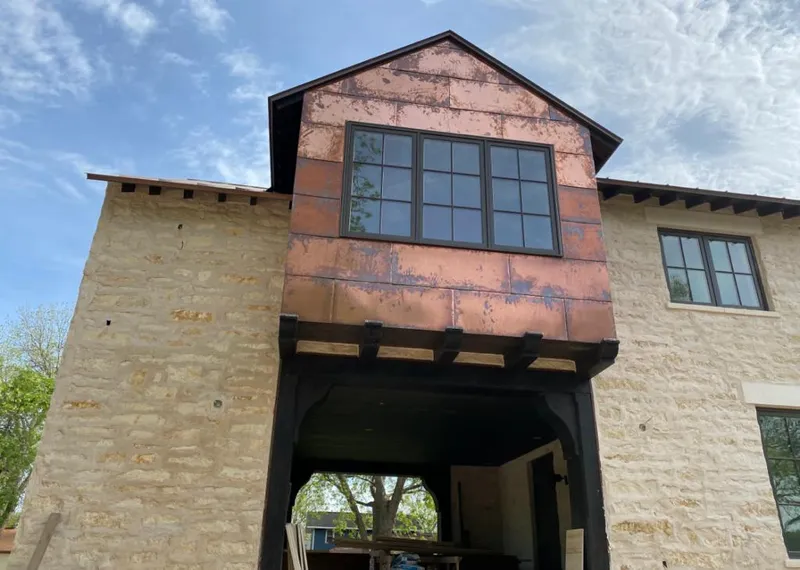 Copper metal panel facade on a stone building for Roof Repair in Pismo Beach